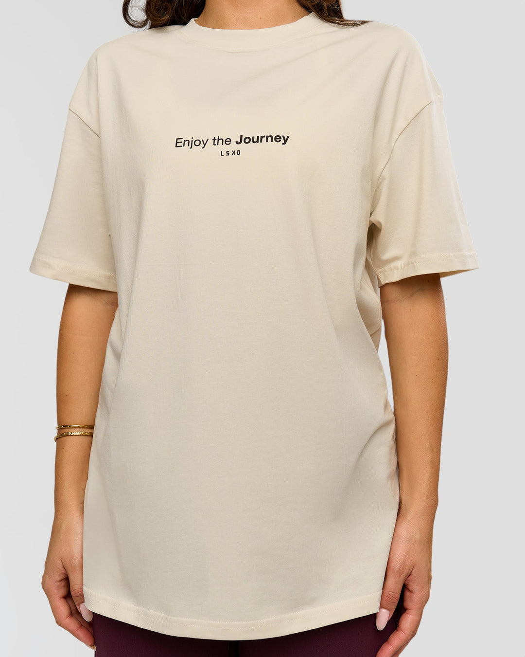 Woman wearing VS1 Enjoy The Journey FLXCotton Oversize Tee - Vanilla Bean | Model:Bianca | Size:XS - view 12
