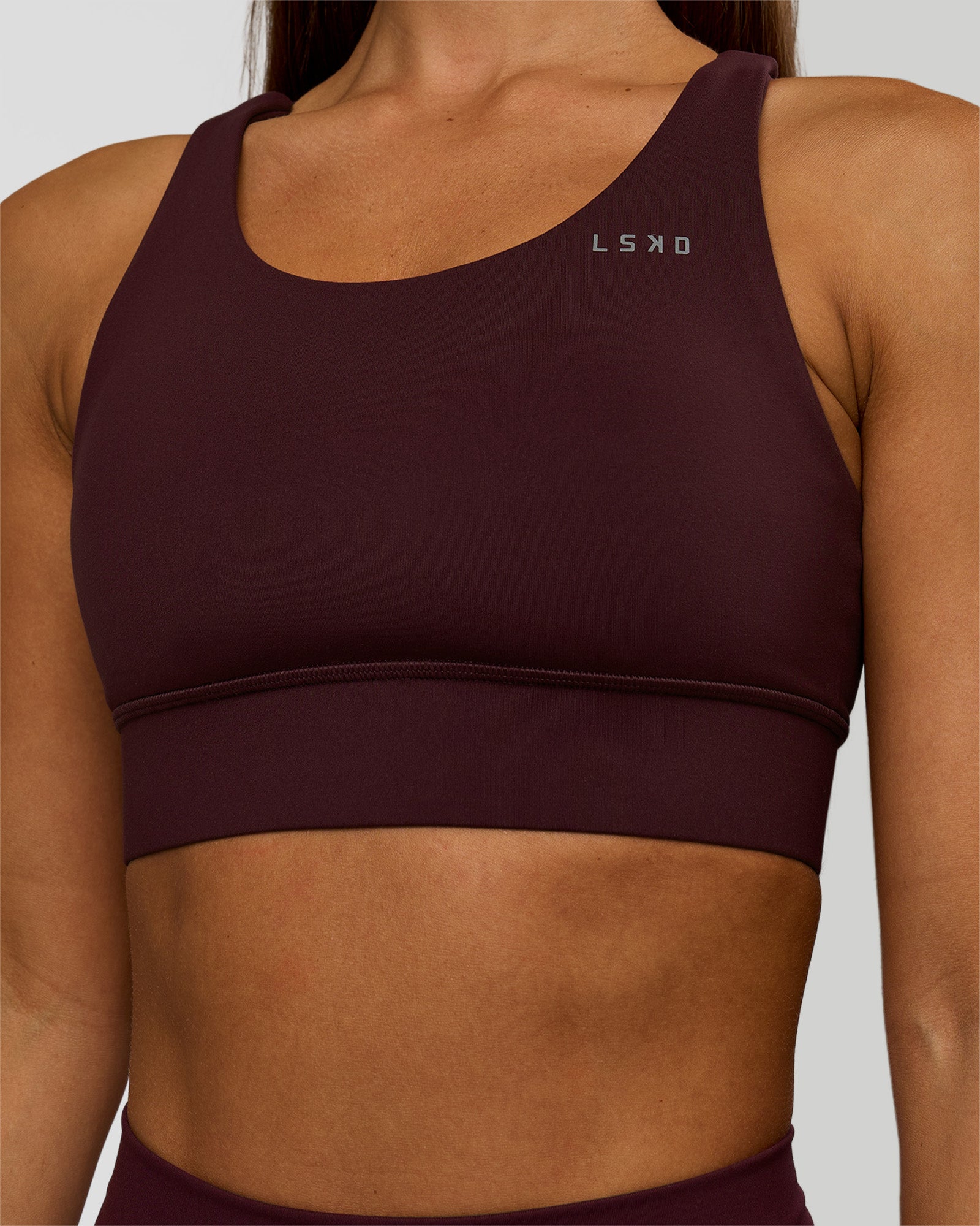 Woman wearing Accelerate Sports Bra - Cherry Lacquer | Model:Brylee | Size:XS