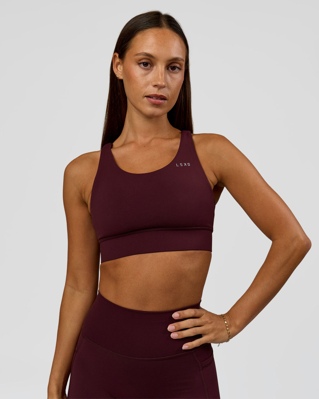 Woman wearing Accelerate Sports Bra - Cherry Lacquer | Model:Brylee | Size:XS - view 2