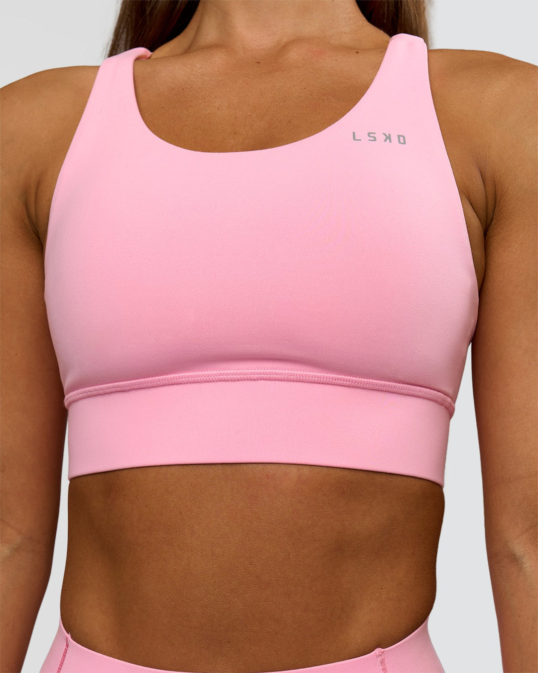 Woman wearing Accelerate Sports Bra - Pink Rose | Model:Brylee | Size:XS