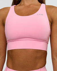 Woman wearing Accelerate Sports Bra - Pink Rose | Model:Brylee | Size:XS