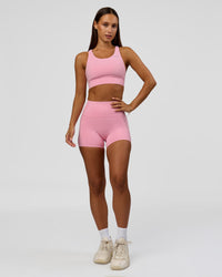 Woman wearing Accelerate Sports Bra - Pink Rose | Model:Brylee | Size:XS