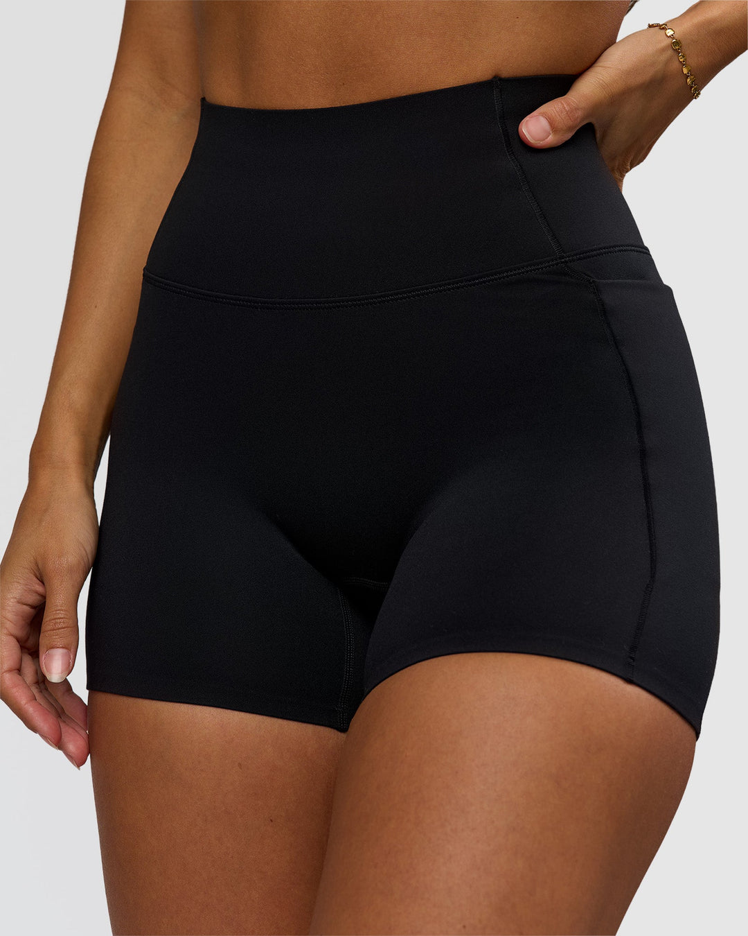 Woman wearing Fusion Bonded High-Rise 4" Short Pockets - Black | Model:Brylee | Size:XS - view 1