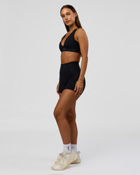 Woman wearing Fusion Bonded High-Rise 4" Short Pockets - Black | Model:Brylee | Size:XS | Thumbnail Index: 7