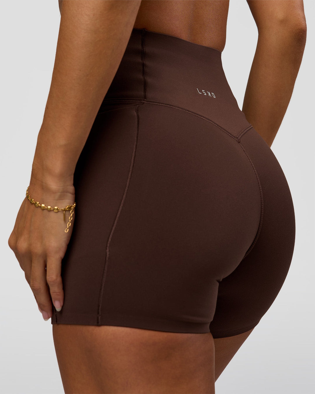 Woman wearing Fusion Bonded High-Rise 4" Short Pockets - Hot Chocolate | Model:Brylee | Size:XS - view 1
