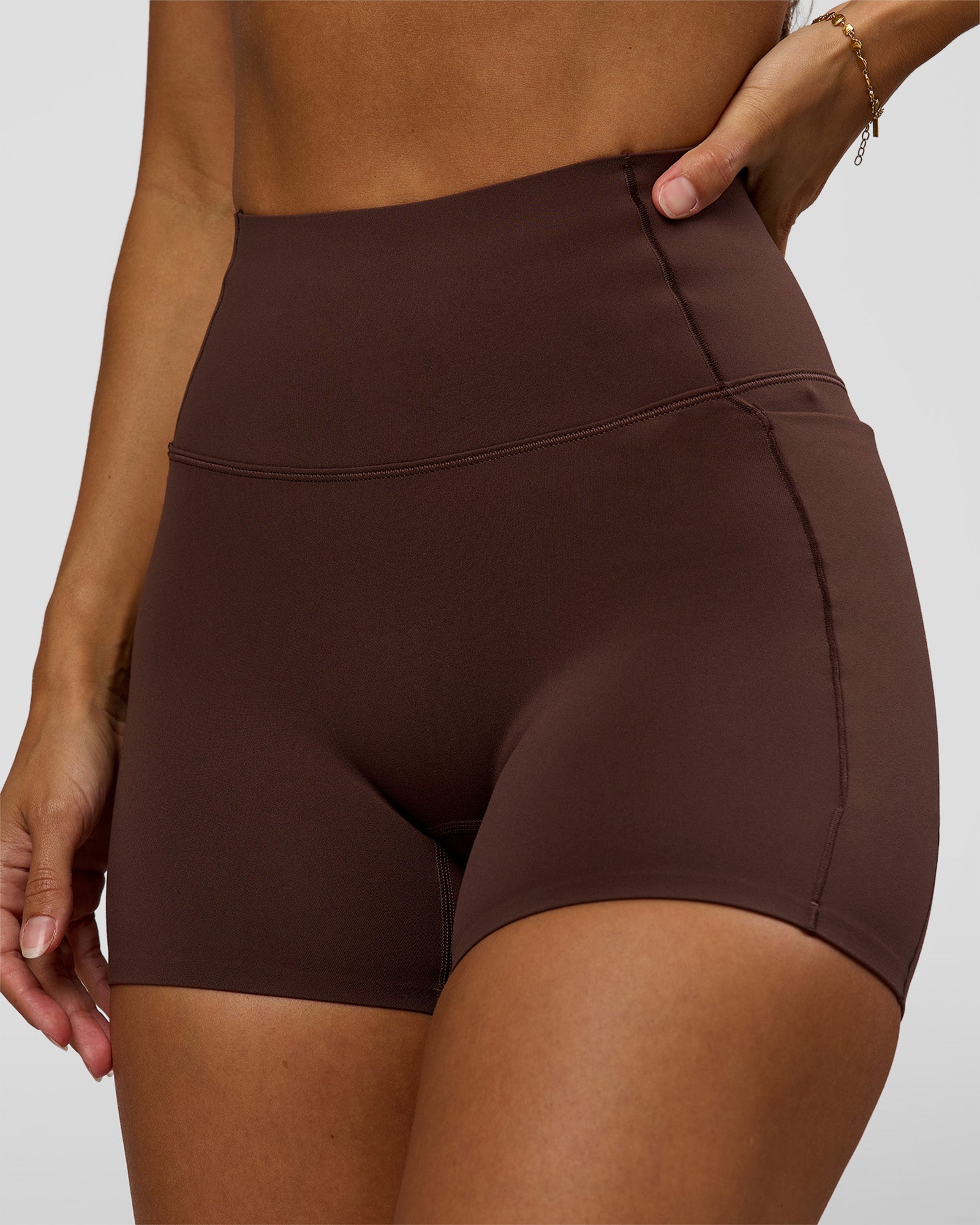 Woman wearing Fusion Bonded High-Rise 4" Short Pockets - Hot Chocolate | Model:Brylee | Size:XS