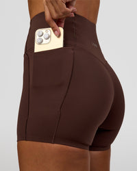 Woman wearing Fusion Bonded High-Rise 4" Short Pockets - Hot Chocolate | Model:Brylee | Size:XS | Thumbnail Index: 6