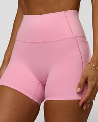 Woman wearing Fusion Bonded High-Rise 4" Short Pockets - Pink Rose | Model:Brylee | Size:XS | Thumbnail Index: 1