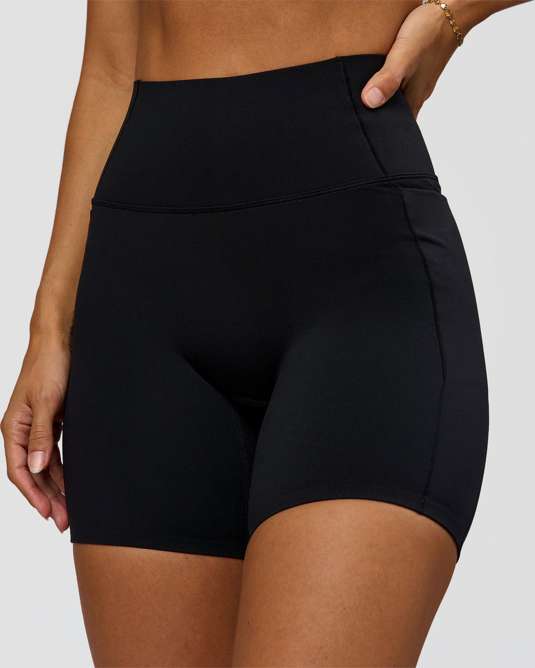 Woman wearing Fusion Bonded High-Rise 6" Short Pockets - Black | Model:Brylee | Size:XS - view 1