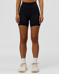 Woman wearing Fusion Bonded High-Rise 6" Short Pockets - Black | Model:Brylee | Size:XS | Thumbnail Index: 5