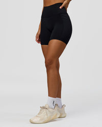 Woman wearing Fusion Bonded High-Rise 6" Short Pockets - Black | Model:Brylee | Size:XS | Thumbnail Index: 7