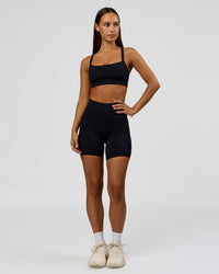 Woman wearing Fusion Bonded High-Rise 6" Short Pockets - Black | Model:Brylee | Size:XS | Thumbnail Index: 4