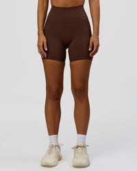 Woman wearing Fusion Bonded High-Rise 6" Short Pockets - Hot Chocolate | Model:Brylee | Size:XS | Thumbnail Index: 1