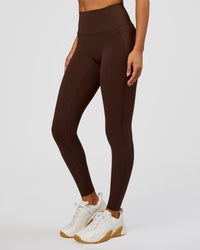 Woman wearing Fusion Bonded High-Rise Full Length Legging Pockets - Hot Chocolate | Model:Brylee | Size:XS | Thumbnail Index: 0