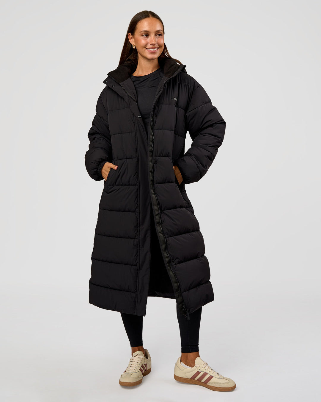 Woman wearing Go-To Puffer Long Jacket - Black | Model:Brylee | Size:XS - view 2