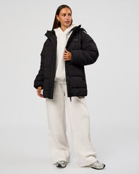 Woman wearing Go-To Puffer Mid Jacket - Black | Model:Brylee | Size:XS | Thumbnail Index: 2