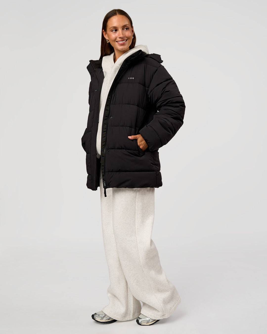 Woman wearing Go-To Puffer Mid Jacket - Black | Model:Brylee | Size:XS - view 4