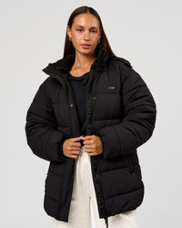 Woman wearing Go-To Puffer Mid Jacket - Black | Model:Brylee | Size:XS | Thumbnail Index: 0