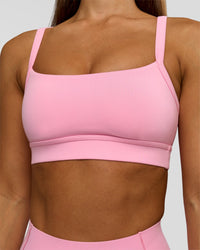 Woman wearing Momentum Sports Bra - Pink Rose | Model:Brylee | Size:XS | Thumbnail Index: 0