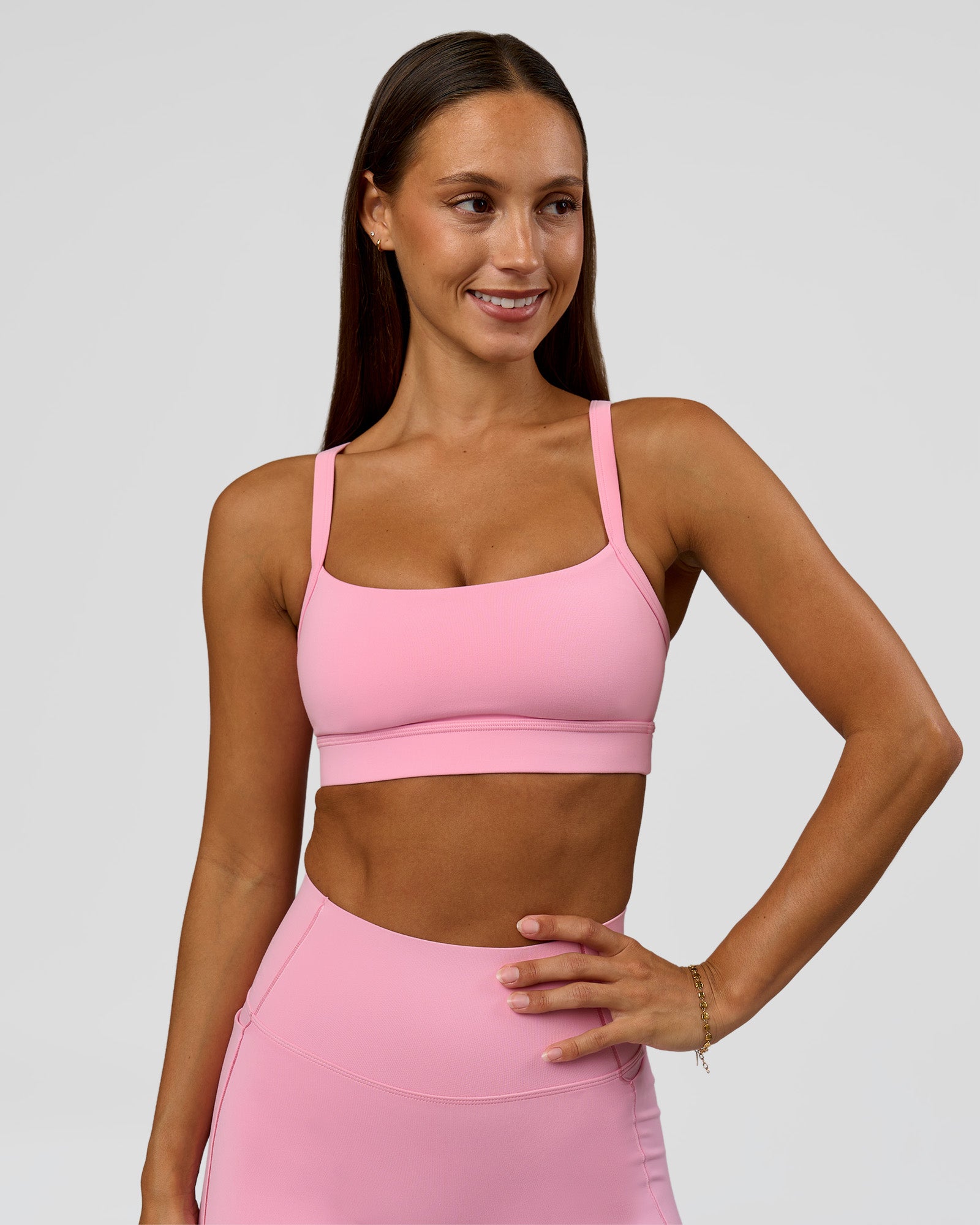 Woman wearing Momentum Sports Bra - Pink Rose | Model:Brylee | Size:XS