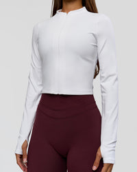 Woman wearing Sculpt Full Zip Long Sleeve Top - White | Model:Brylee | Size:XS | Thumbnail Index: 4