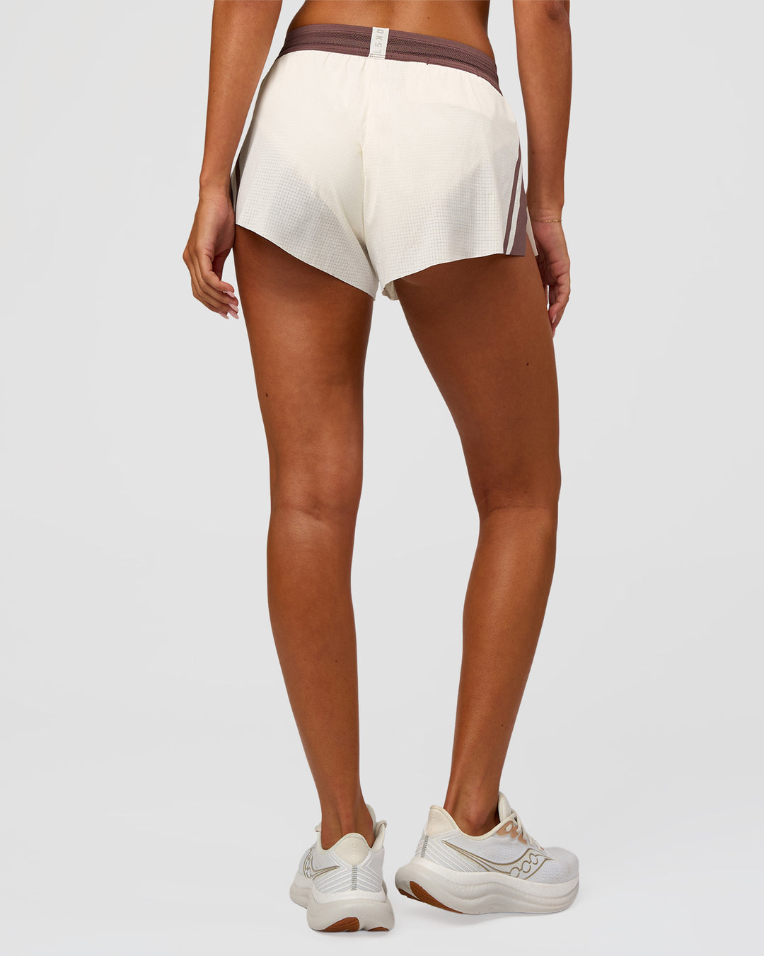 Woman wearing Accelerate 3" Force Mid-Rise Running Short - Cocoa powder-Off White | Model:Charli | Size:XS - view 8