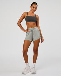 Woman wearing Accelerate 3" High-Rise Running Short - Alloy | Model:Charli | Size:XS | Thumbnail Index: 1