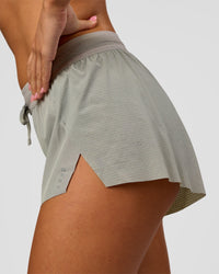 Woman wearing Accelerate 3" Mid-Rise Running Short - Alloy | Model:Charli | Size:XS | Thumbnail Index: 3
