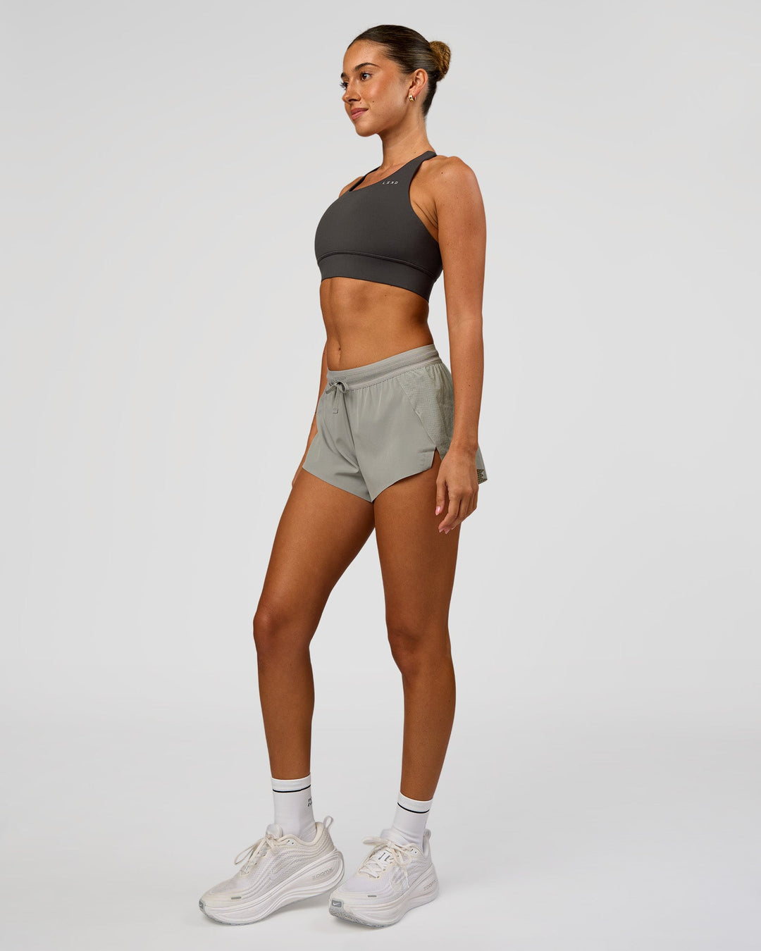 Woman wearing Accelerate 3" Mid-Rise Running Short - Alloy | Model:Charli | Size:XS - view 7