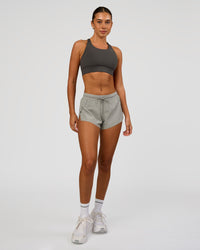Woman wearing Accelerate 3" Mid-Rise Running Short - Alloy | Model:Charli | Size:XS | Thumbnail Index: 1
