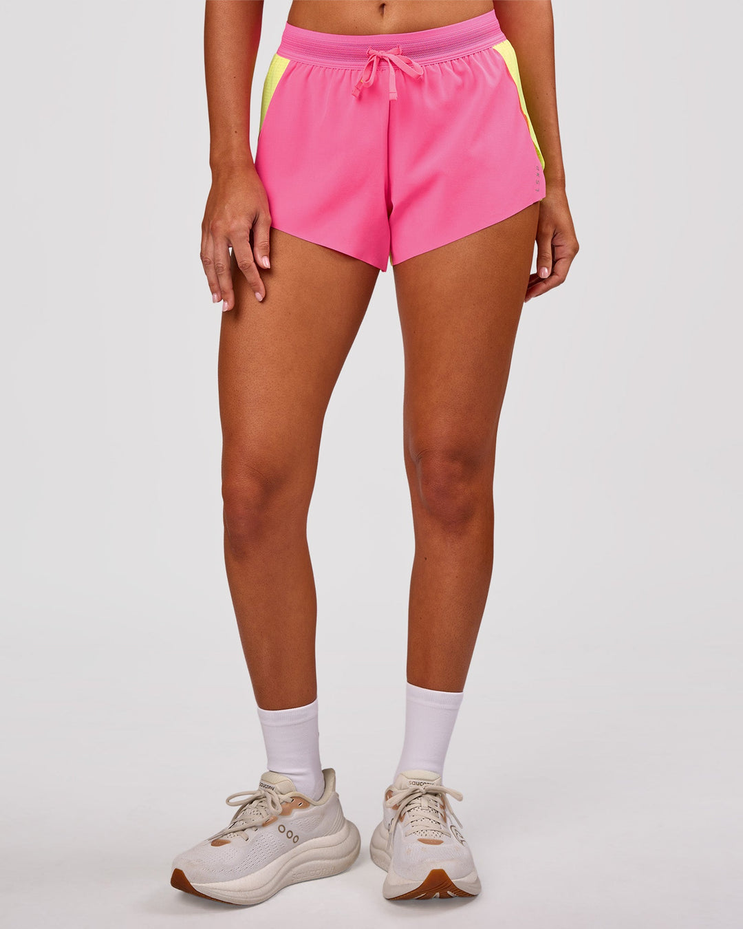 Woman wearing Accelerate 3" Mid-Rise Running Short - Lime Glo-Sugar Plum | Model:Charli | Size:XS - view 13