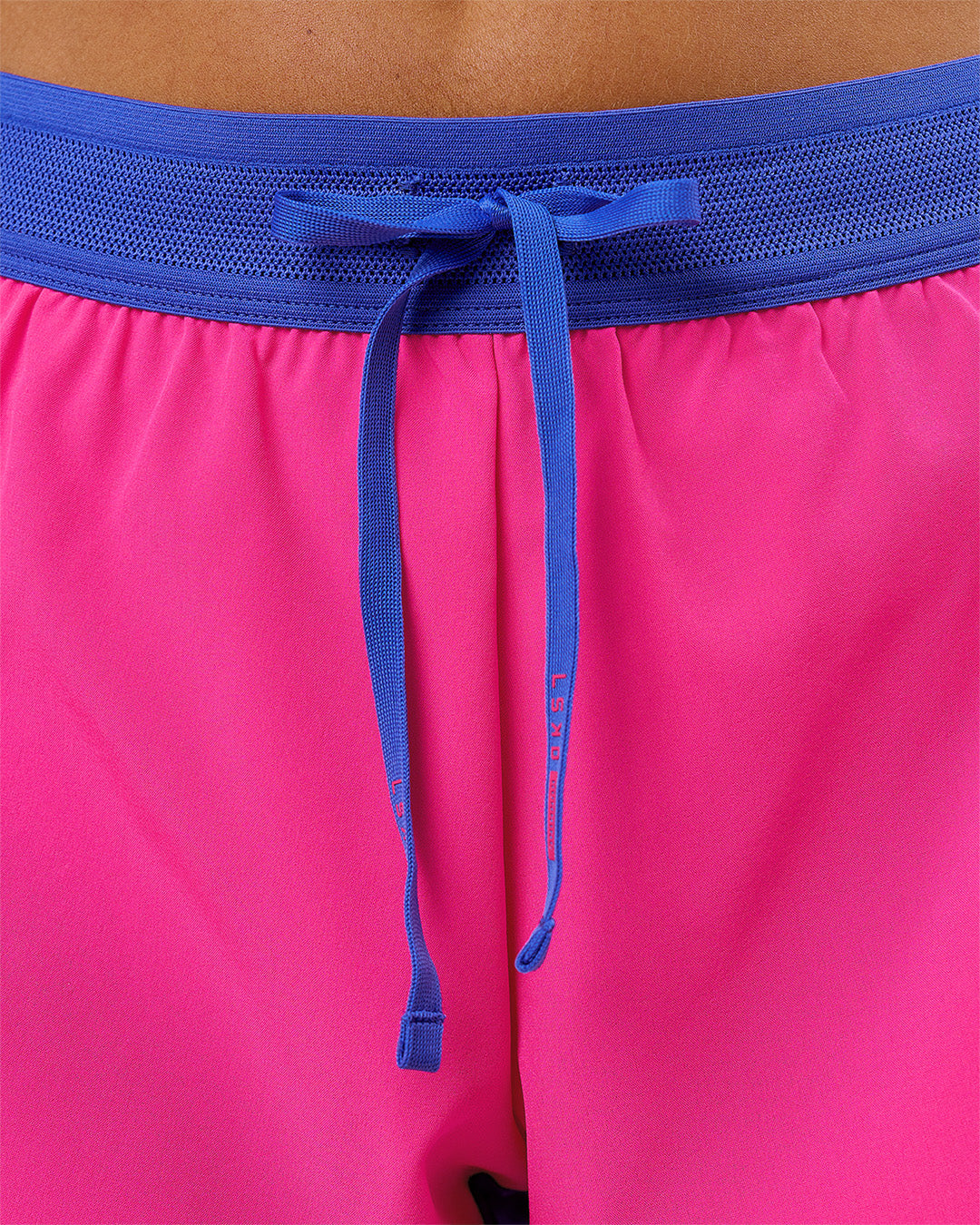 Woman wearing Accelerate 3" Mid-Rise Running Short - Power Cobalt- Ultra Pink | Model:Charli | Size:XS - view 5