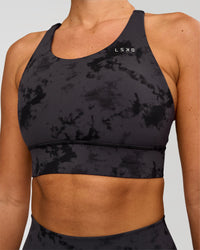 Woman wearing Accelerate Split Strap Sports Bra - Black Tie Dye | Model:Charli | Size:XS | Thumbnail Index: 3
