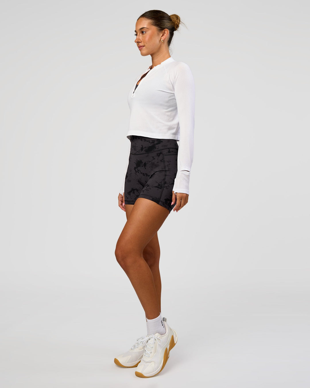 Woman wearing AeroFLX+ Long Sleeve Skimmer Half Zip - White/White | Model:Charli | Size:XS - view 4