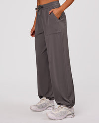 Woman wearing Bend Woven Pant - Duskstone | Model:Charli | Size:XS | Thumbnail Index: 8