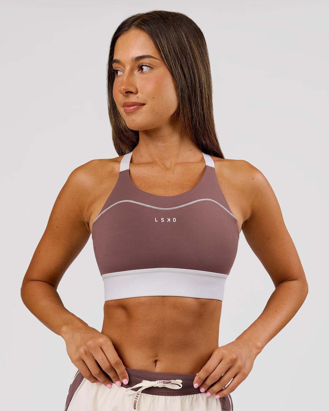 Woman wearing Elevated Accelerate Sports Bra - Cocoa Power-White | Model:Charli | Size:XS - view 7