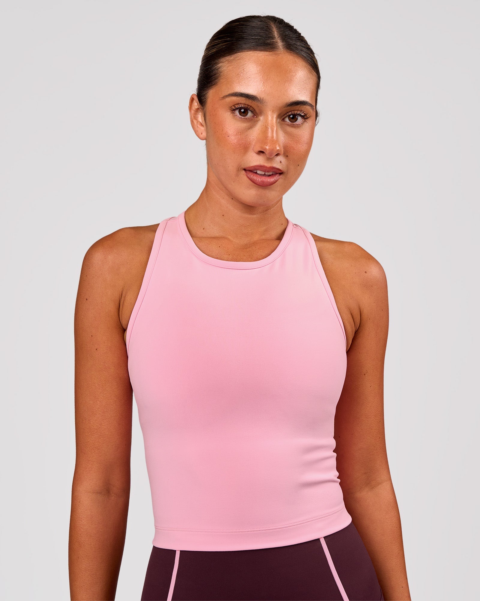Woman wearing Flow Performance Tank 2.0 - Pink Rose | Model:Charli | Size:XS