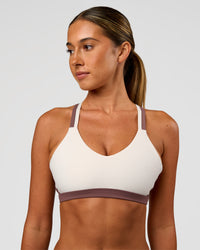 Woman wearing Force Sports Bra - Cocoa Powder-Off White | Model:Charli | Size:XS | Thumbnail Index: 0