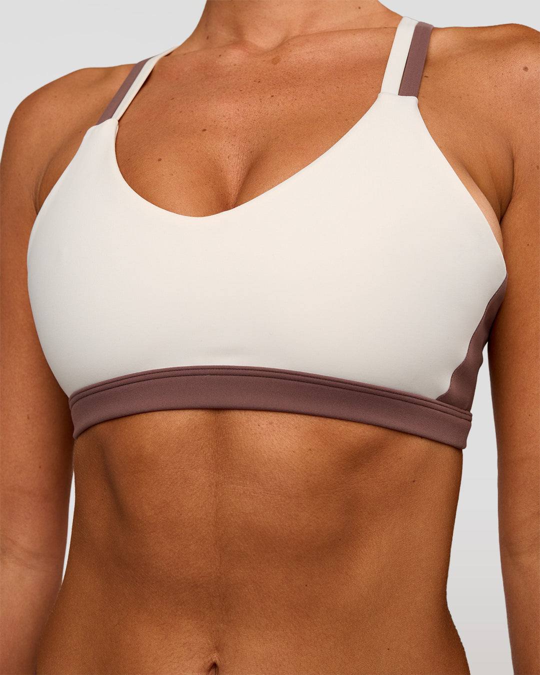 Woman wearing Force Sports Bra - Cocoa Powder-Off White | Model:Charli | Size:XS - view 3