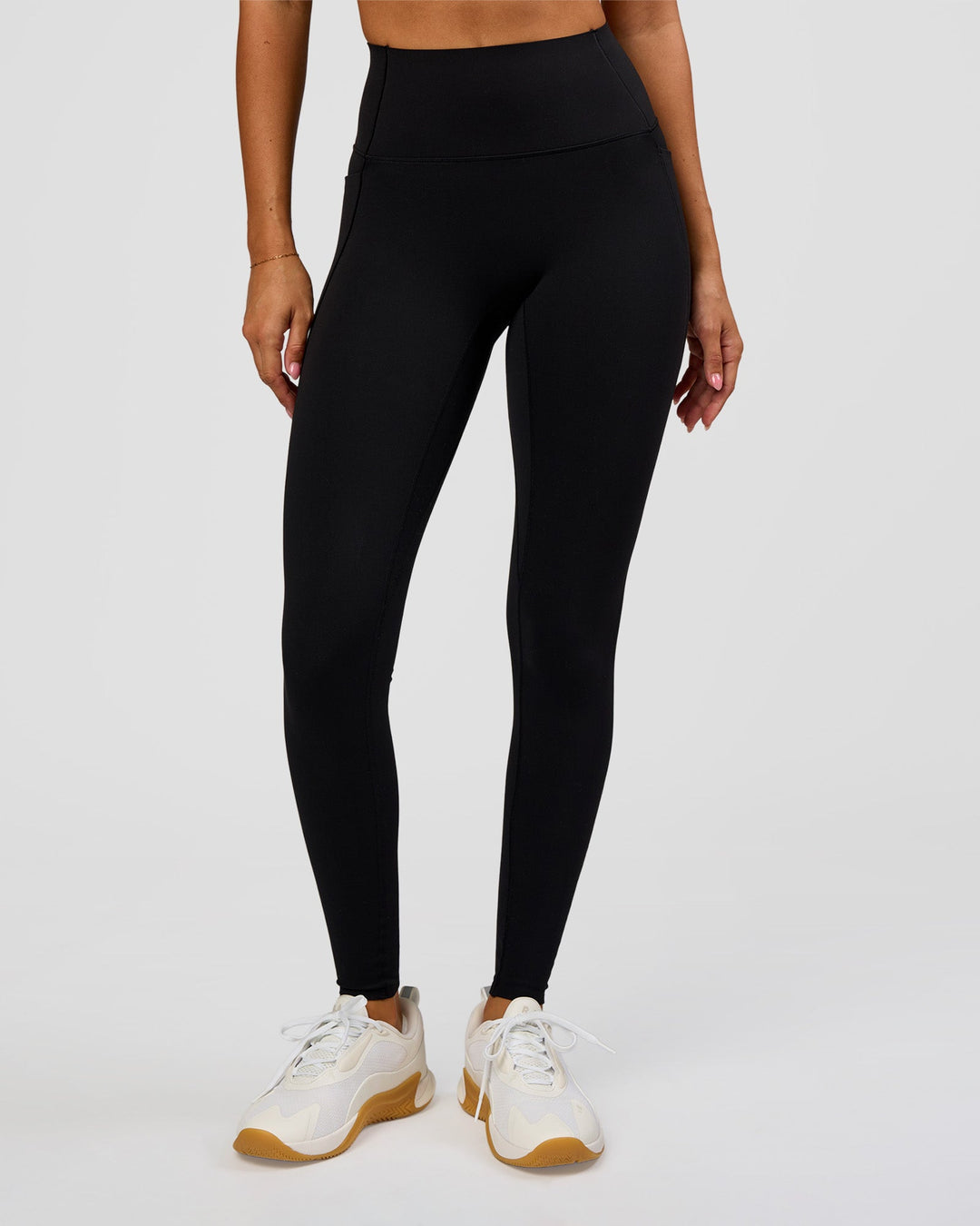 Woman wearing Fusion Bonded High-Rise Full Length Legging Pockets - Black | Model:Charli | Size:XS - view 1