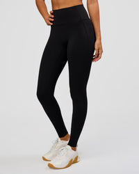 Woman wearing Fusion Bonded High-Rise Full Length Legging Pockets - Black | Model:Charli | Size:XS | Thumbnail Index: 4