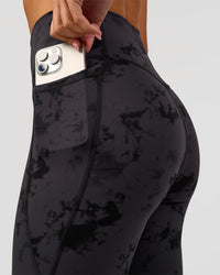 Woman wearing Fusion Ultra High-Rise Full Length Legging Pockets - Black Tie Dye | Model:Charli | Size:XS | Thumbnail Index: 9