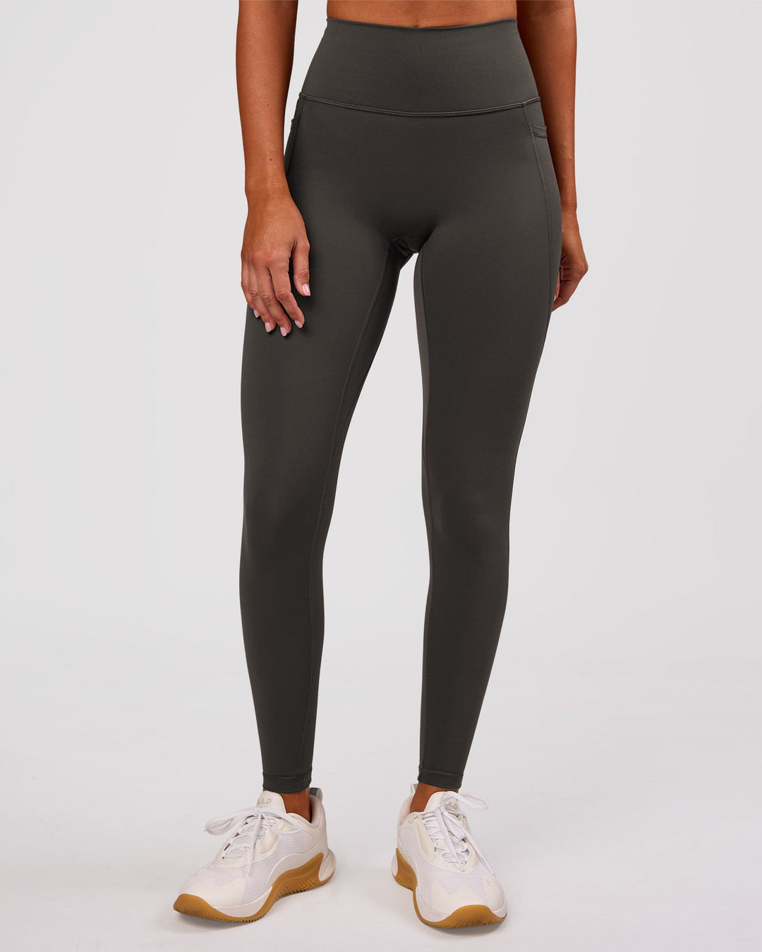 Woman wearing Fusion Ultra High-Rise Full Length Legging Pockets - Onyx | Model:Charli | Size:XS - view 3