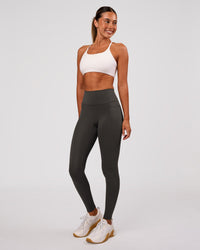 Woman wearing Fusion Ultra High-Rise Full Length Legging Pockets - Onyx | Model:Charli | Size:XS | Thumbnail Index: 3
