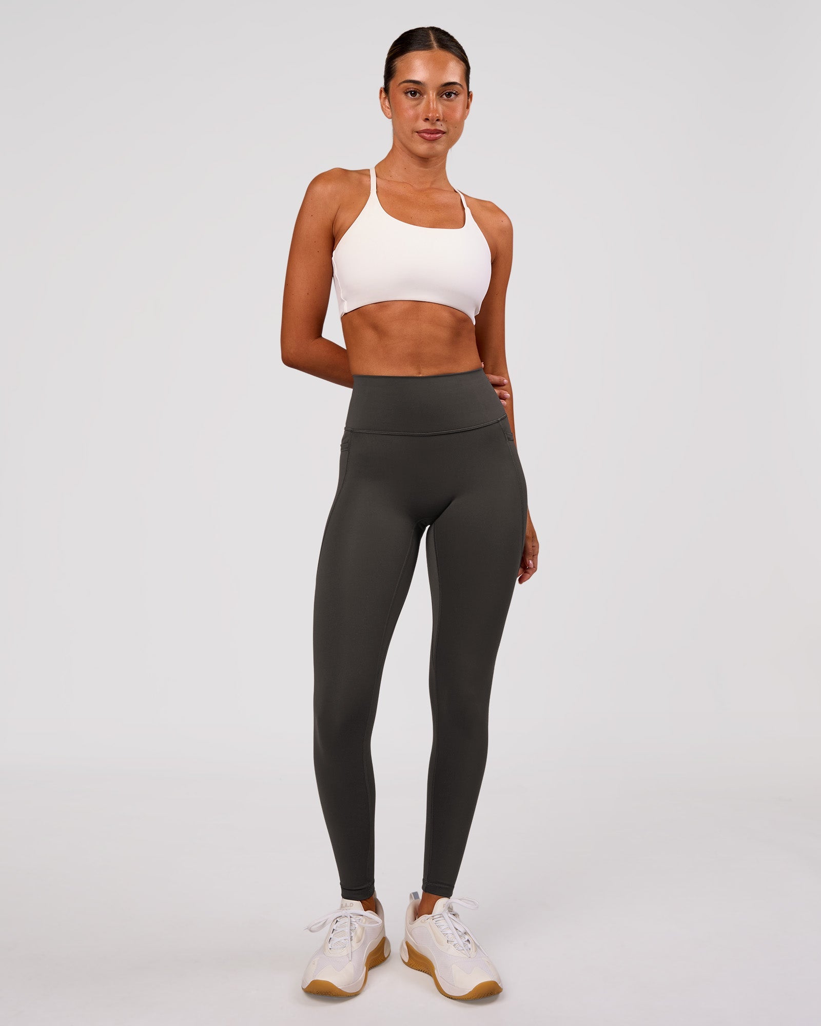 Woman wearing Fusion Ultra High-Rise Full Length Legging Pockets - Onyx | Model:Charli | Size:XS