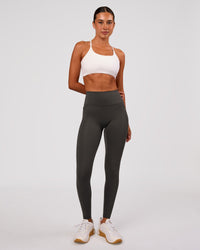 Woman wearing Fusion Ultra High-Rise Full Length Legging Pockets - Onyx | Model:Charli | Size:XS | Thumbnail Index: 0