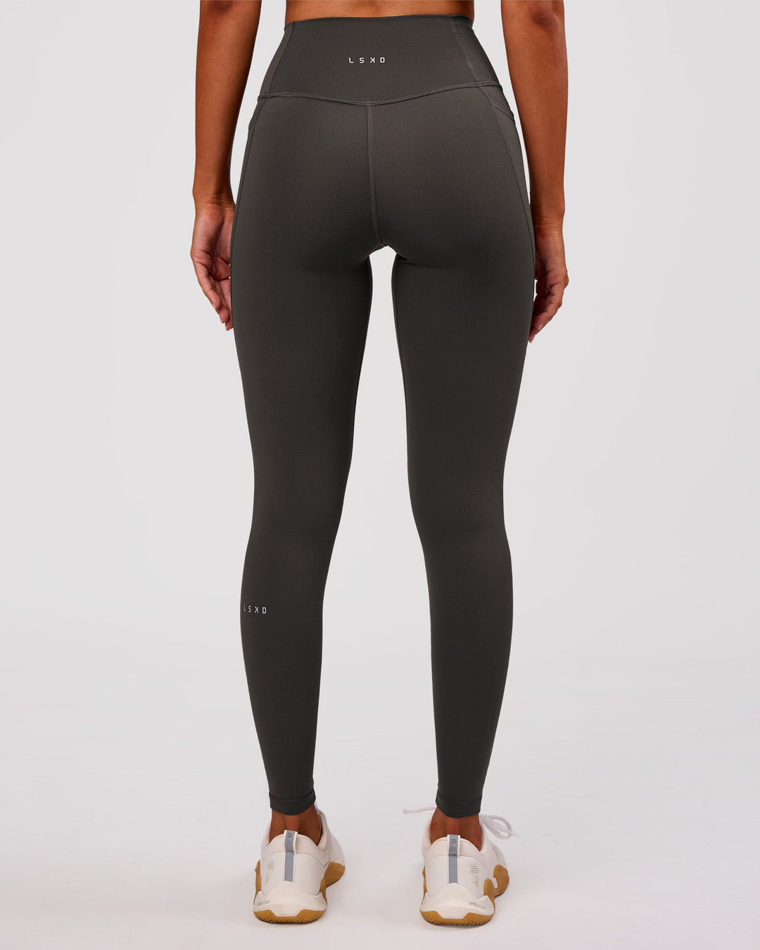 Woman wearing Fusion Ultra High-Rise Full Length Legging Pockets - Onyx | Model:Charli | Size:XS - view 8