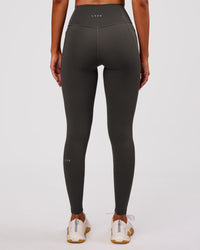 Woman wearing Fusion Ultra High-Rise Full Length Legging Pockets - Onyx | Model:Charli | Size:XS | Thumbnail Index: 7