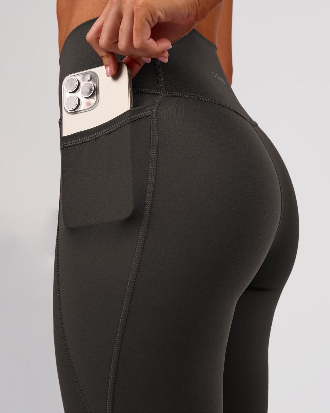 Woman wearing Fusion Ultra High-Rise Full Length Legging Pockets - Onyx | Model:Charli | Size:XS - view 10
