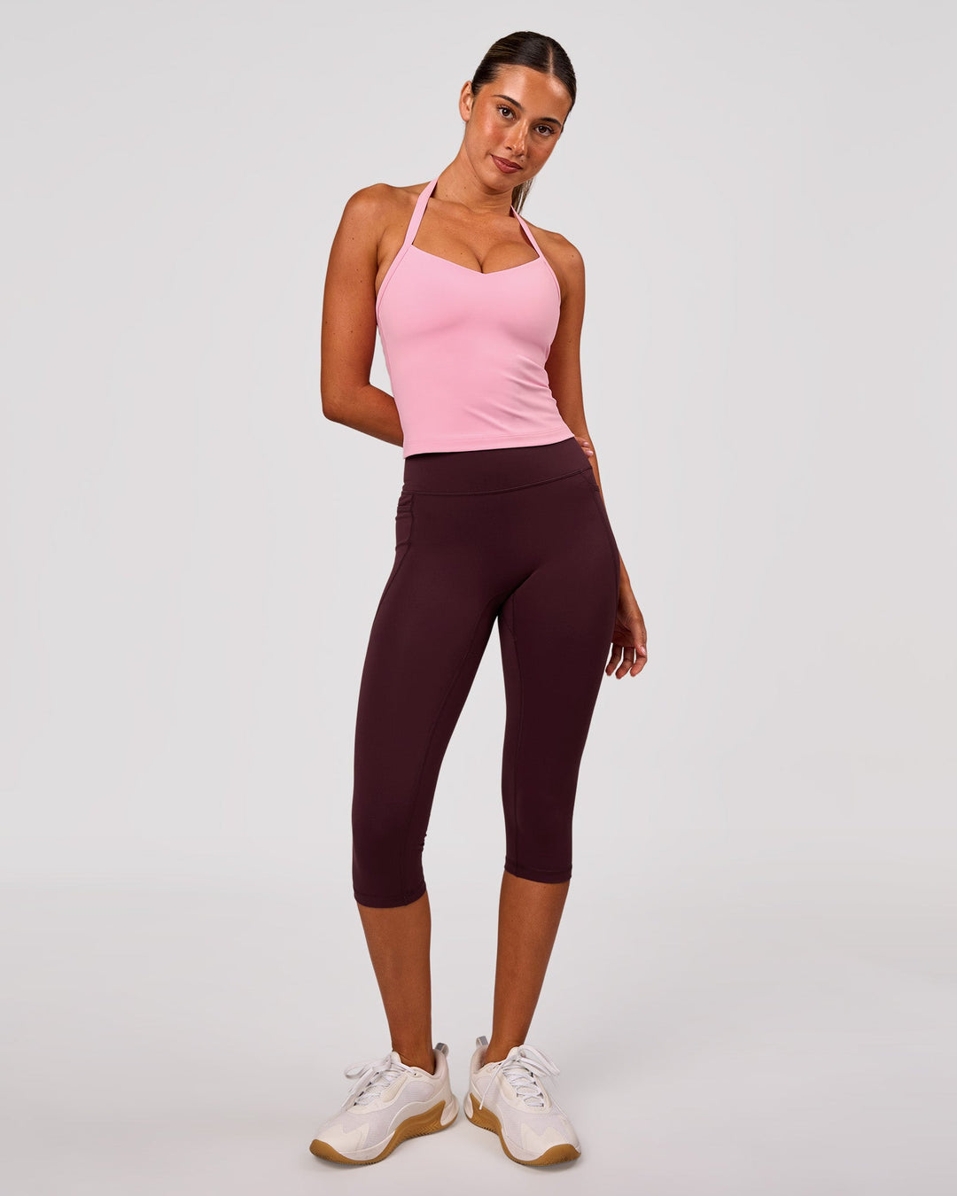 Woman wearing Fusion V Contour Ultra High-Rise 3/4 Legging Pockets - Cherry Lacquer | Model:Charli | Size:XS - view 1